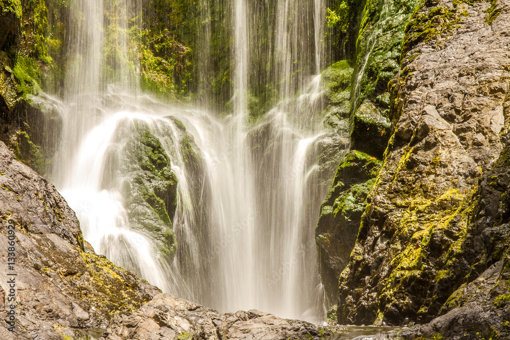 beautiful water fall in forest, new zealand, waipu, piroa falls