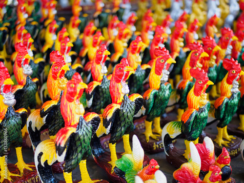 Colorful of a many cock statues, Roosters are placed around the temple dedicated to god of Thailand
