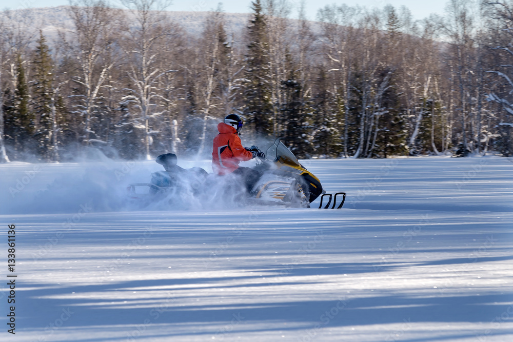 Athlete on a snowmobile