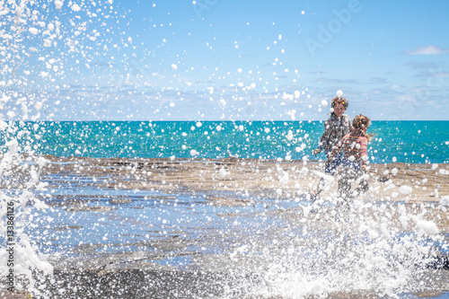 muriwai beach  splashing water  ocean and water waves