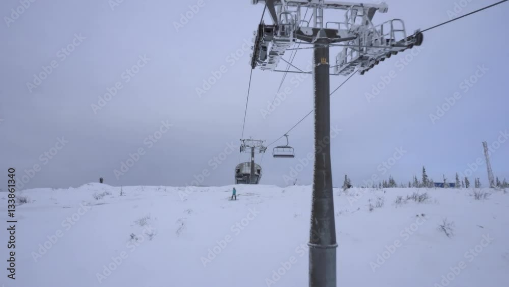 View from the cab of cable car to snow-covered mountain's top View from the cab of cable car to snow-covered mountain's top