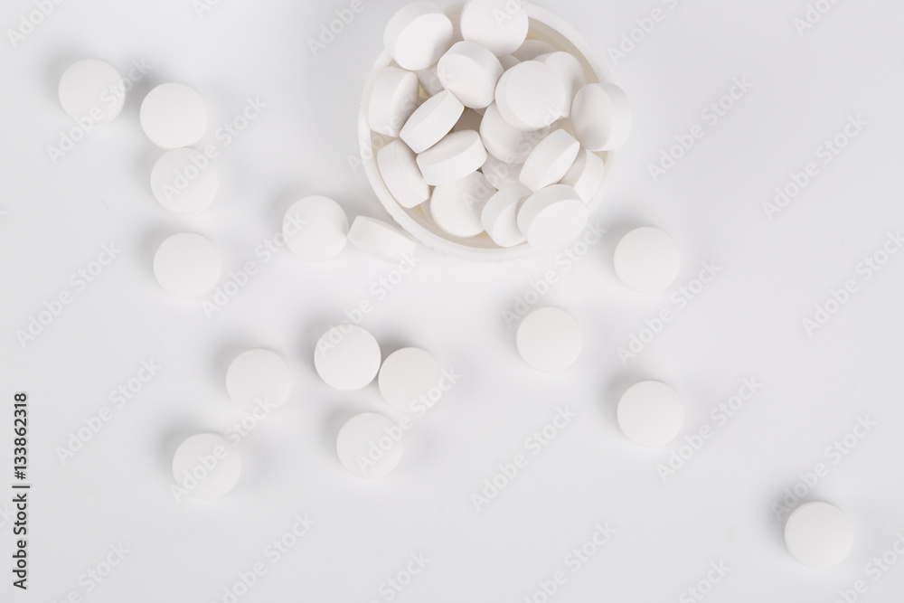 Round white pills on the white background Round white pills on the white background