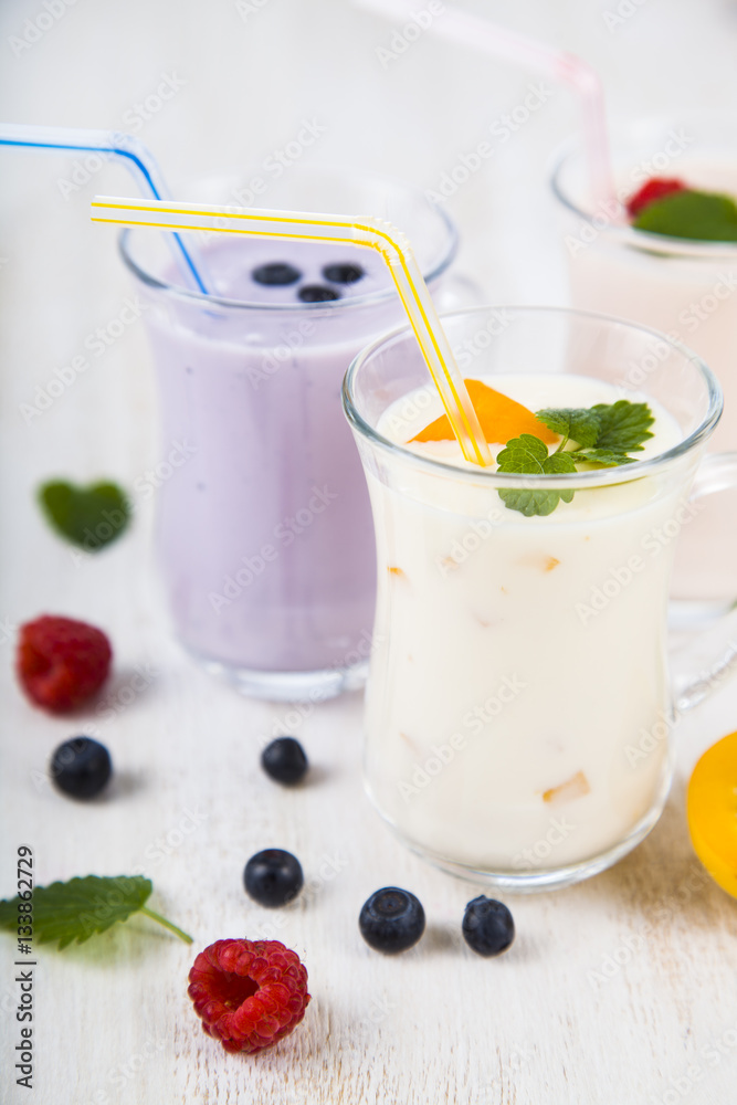 Smoothies or yogurt with fresh berries. Milkshakes with raspberr Smoothies or yogurt with fresh berries. Milkshakes with raspberr