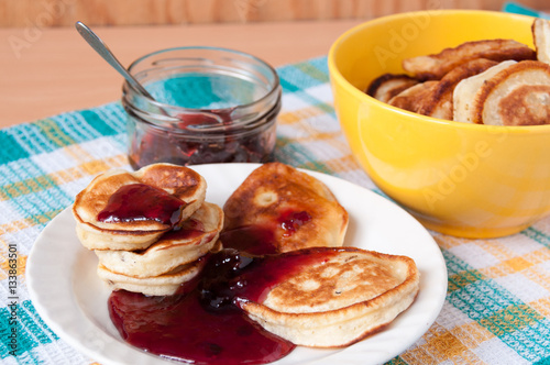 Delicious pancakes for breakfast with cherry jam