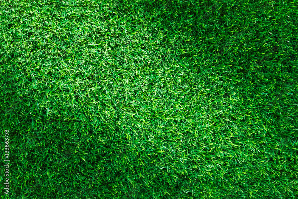 Fototapeta premium Artificial green grass texture for golf course, soccer field or sports background concept design.