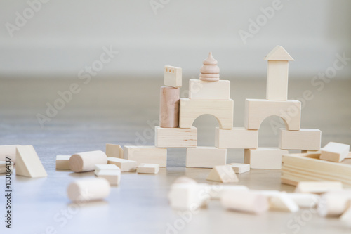 noname wooden buling blocks, building castles and houses from wo photo