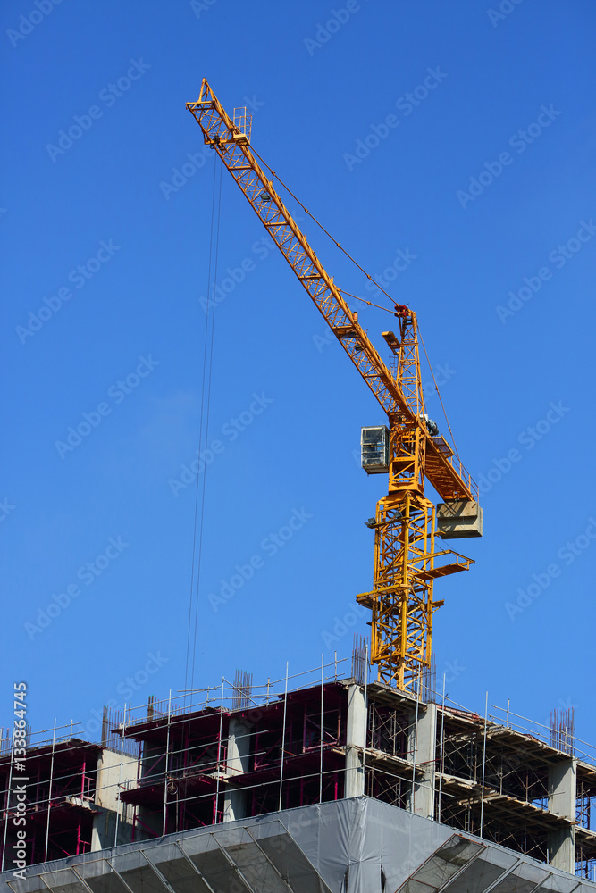 machinery crane working in construction site building machinery crane working in construction site building