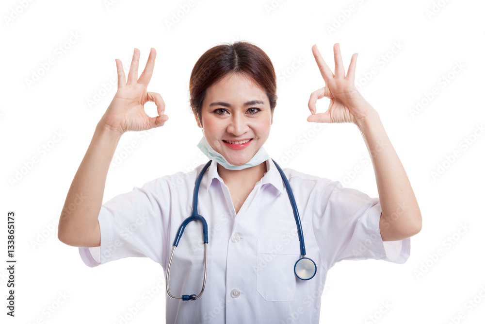 Young Asian female doctor show two OK sign. Young Asian female doctor show two OK sign.