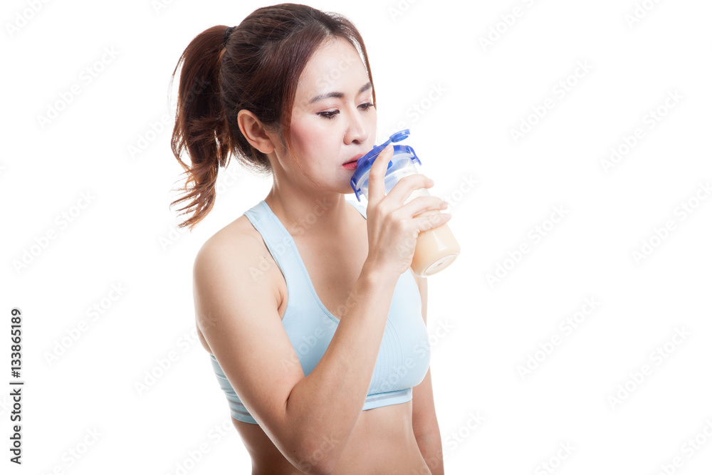 Beautiful Asian healthy girl drinking whey protein. Beautiful Asian healthy girl drinking whey protein.