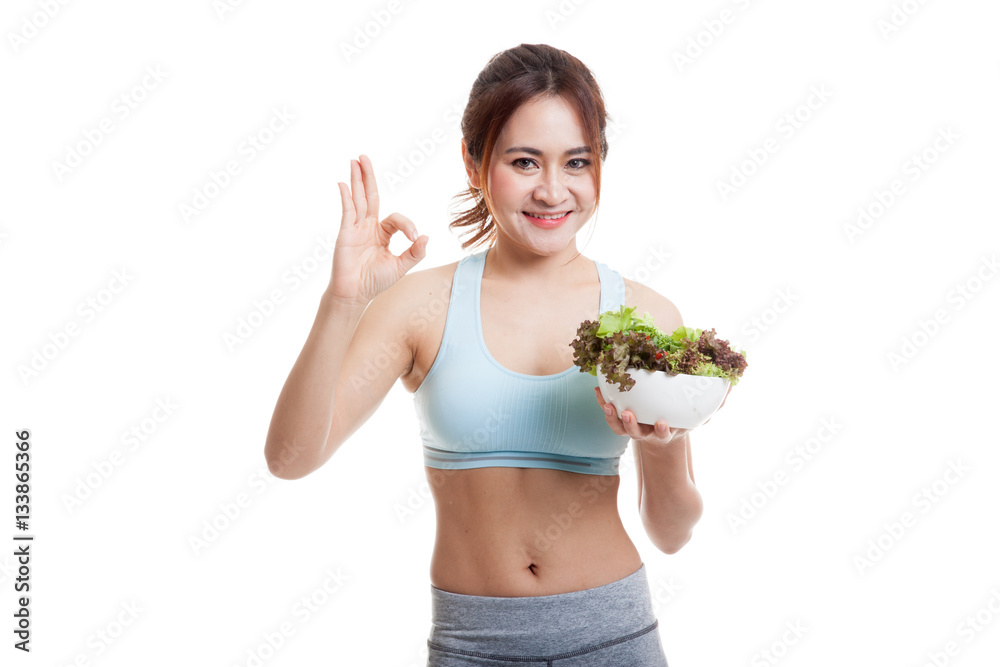 Beautiful Asian healthy girl show OK with salad.