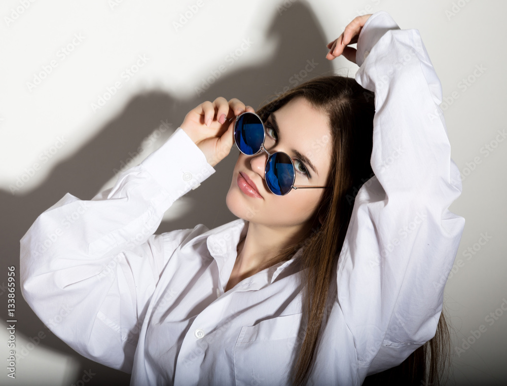naked girl in a man's white shirt with sunglasses naked girl in a man's white shirt with sunglasses