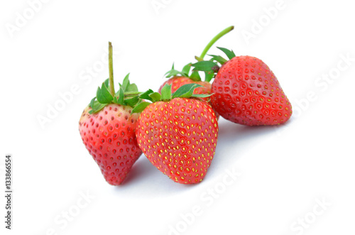 Collection of strawberry fruits of different shaped.