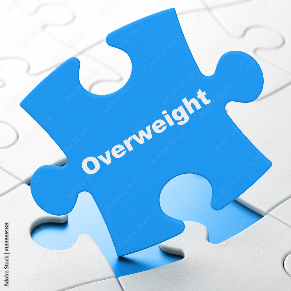 Medicine concept: Overweight on puzzle background Medicine concept: Overweight on puzzle background