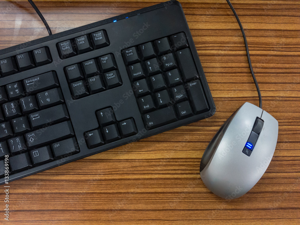 keyboard and mouse on wooden background. keyboard and mouse on wooden background.