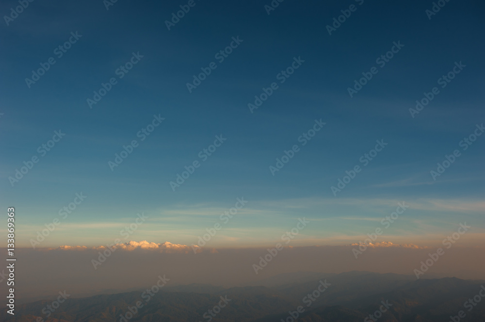 Landscape view from top of mountain on misty morning across coun