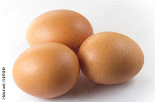 Three eggs on a white background