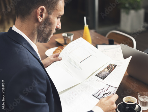 Business Man Reading Newspaper Concept photo