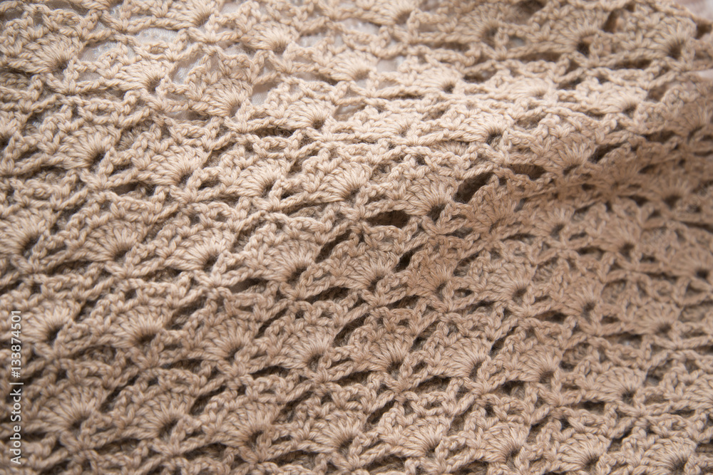 Brown sweater knitted in manual photographed in close-up. Brown sweater knitted in manual photographed in close-up.