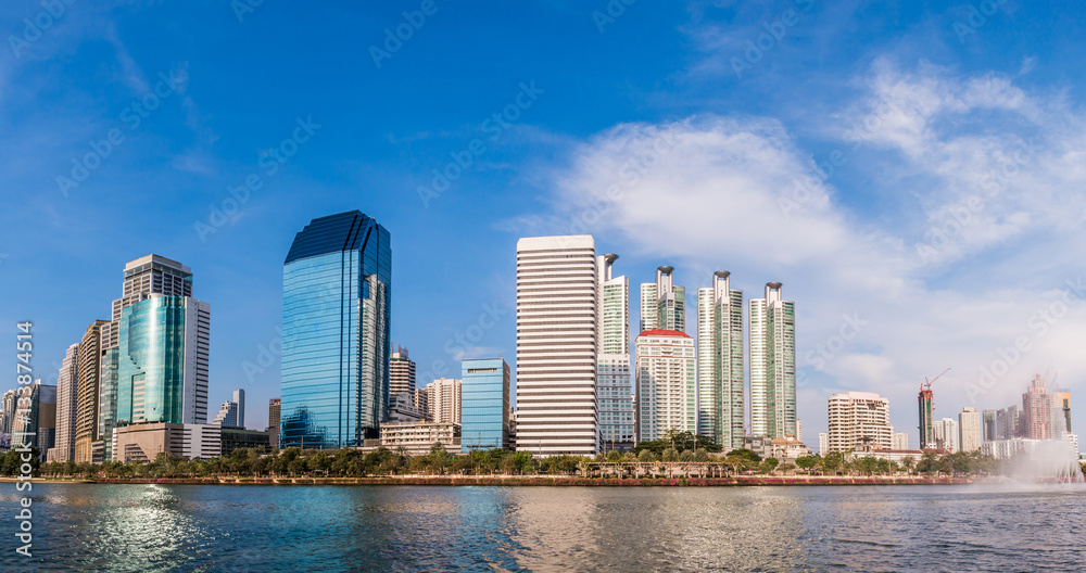 panorama modern building under the blue sky and cloudy with refl panorama modern building under the blue sky and cloudy with refl