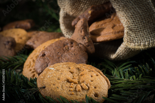 Christmas cookies on a black background with Christmas tree