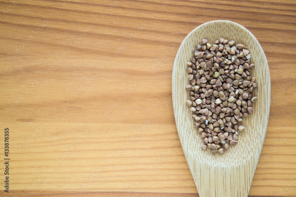 Buckwheat on the wooden board. Healthy eating and lifestyle. Buckwheat on the wooden board. Healthy eating and lifestyle.