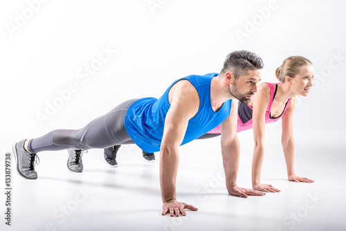 Couple doing plank exercise