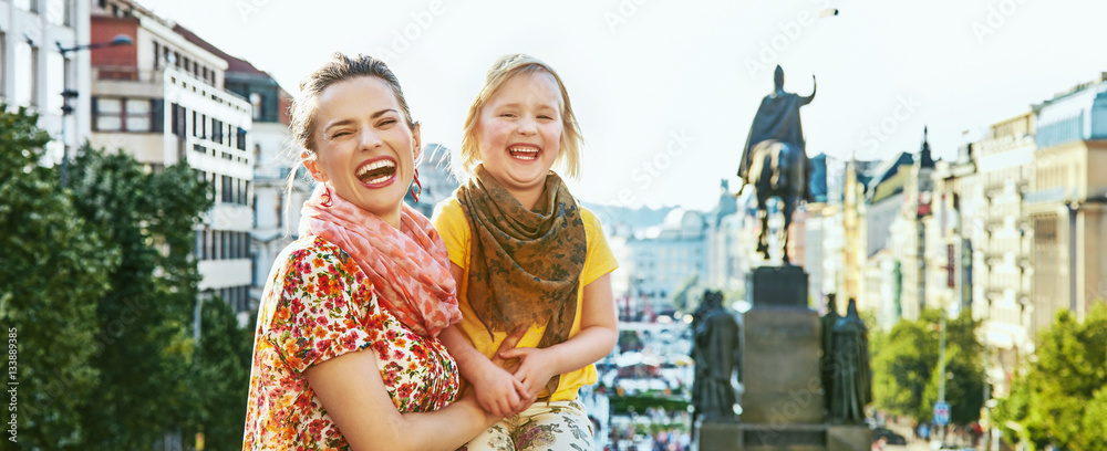Fototapeta premium happy mother and daughter tourists in Prague Czech Republic