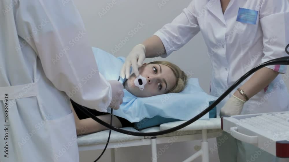 The Doctor Put In The Girl s Mouth Endoscope Is A Medical Device Stock the-doctor-put-in-the-girl-s-mouth-endoscope-is-a-medical-device-stock