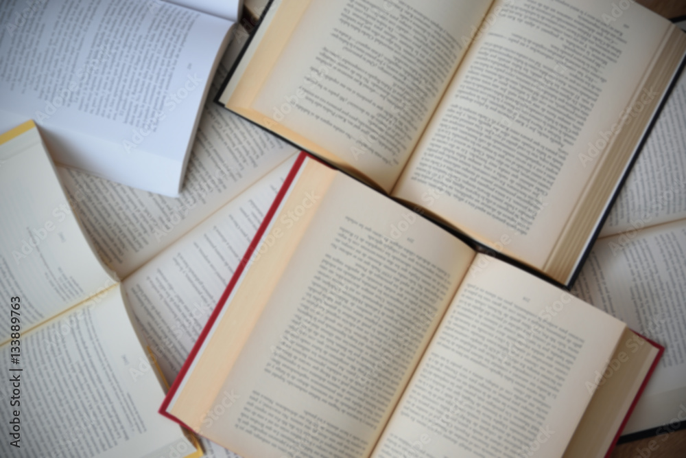 Obraz premium Some open books background. Messy table in a library