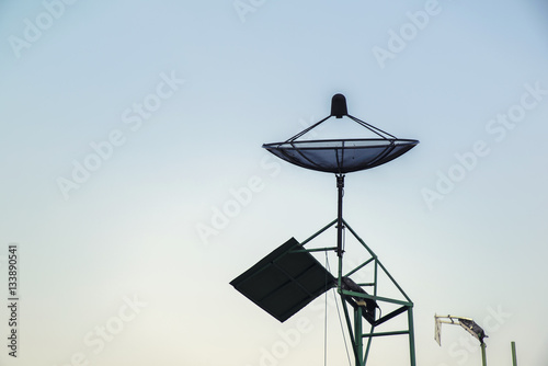 satellite dish on Lamp post with evening time