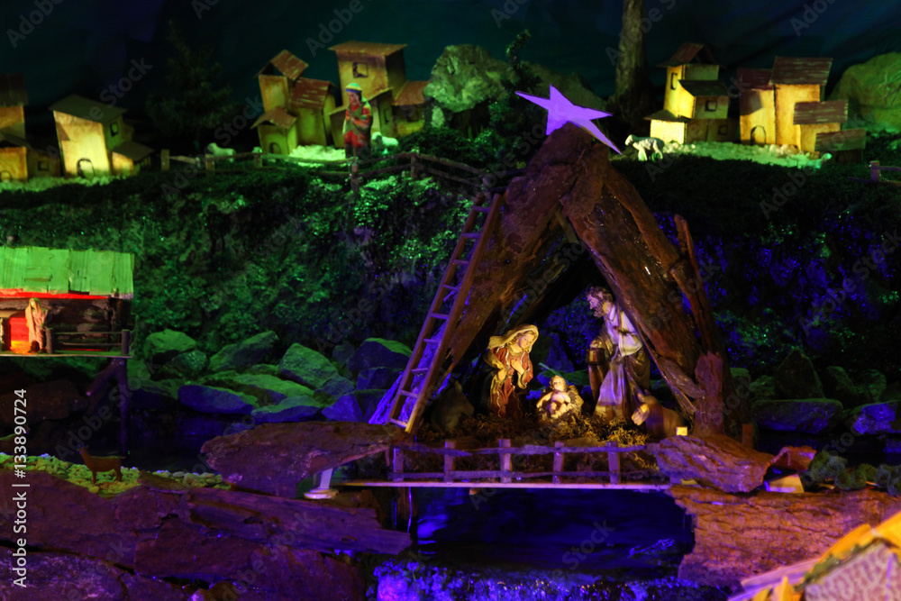 Christmas nativity scene with figurines including Jesus, Mary, Joseph, and sheeps