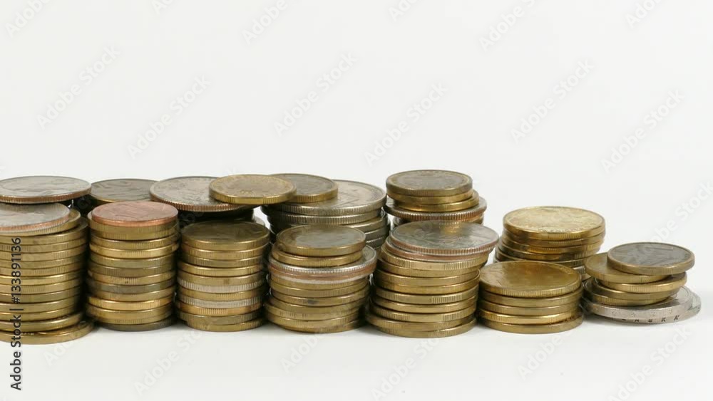 Grenada flag waving with stack of money coins Grenada flag waving with stack of money coins