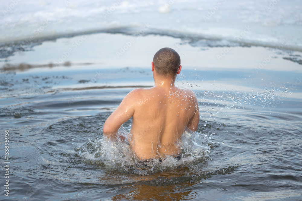 Gomel, Belarus - JANUARY 19, 2017: Bathing in the hole Orthodox people on holiday Baptism of Christ.