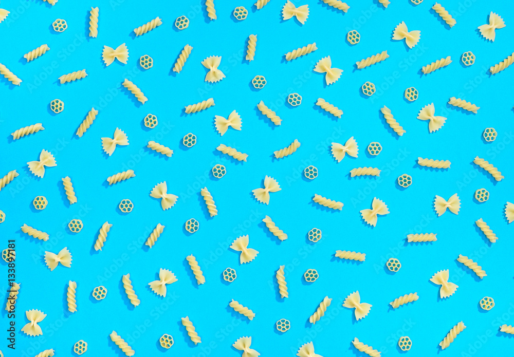 Farfalle, rotelle and fusilli pasta flat lay Farfalle, rotelle and fusilli pasta flat lay