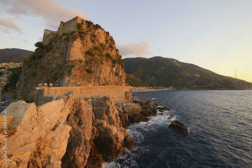 View of Scilla and the Ruffo Castle at sunset, Strait of Messina, Calabria, Italy.