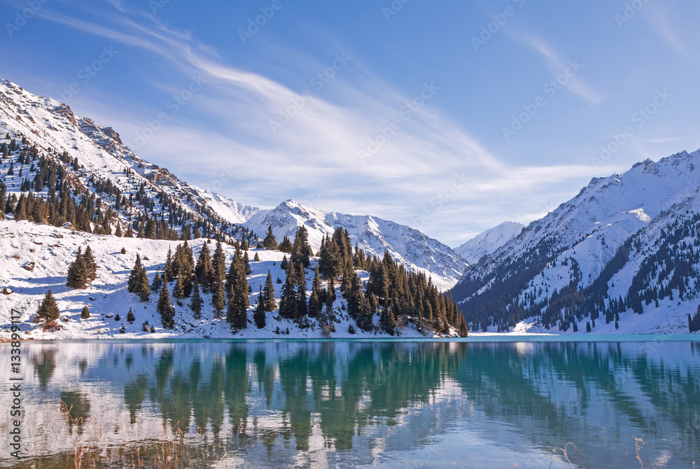 Mirror of mountain soul - emerald mountain lake. Tien-Shan mountains.