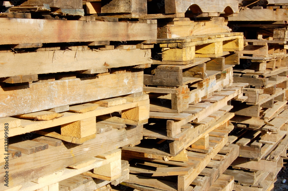 Pallets are used and stacked for reuse. Pallets are used and stacked for reuse.