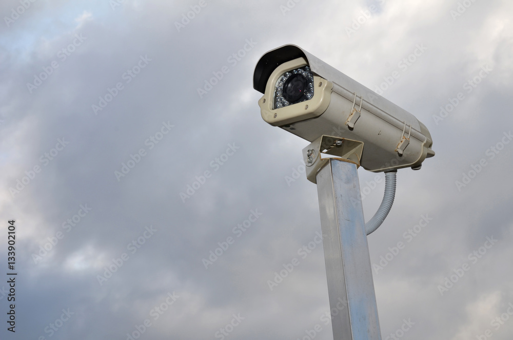 Security camera against a cloudy sky Security camera against a cloudy sky