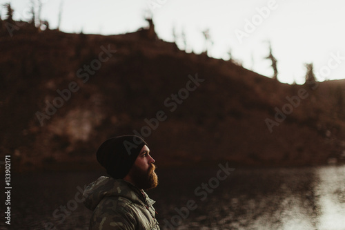 Male hiker gazing near lake, Mineral King, Sequoia National Park, California, USA