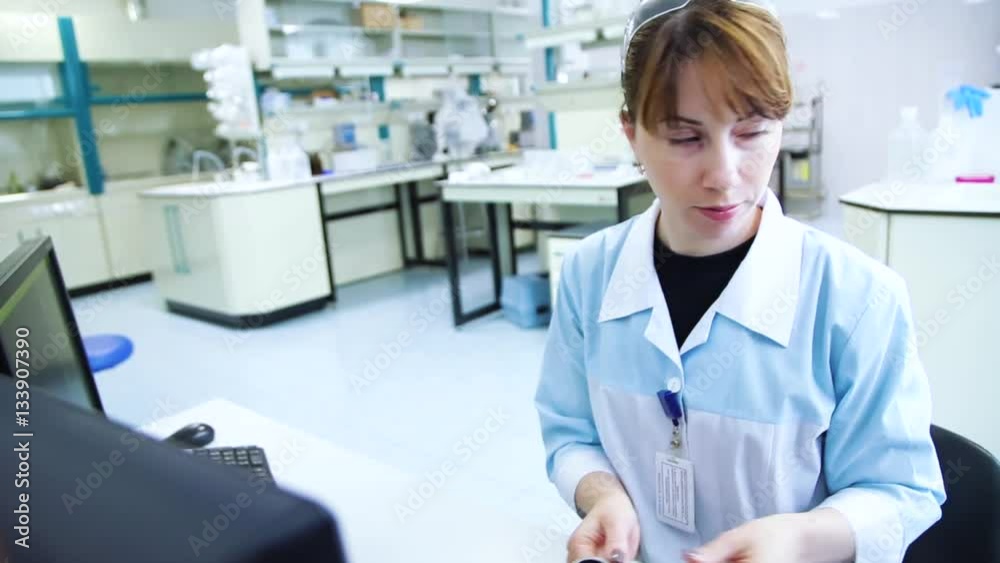 Woman scientist using digital microscope Woman scientist using digital microscope