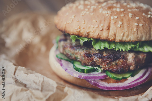 Classic american burger, fast food on wood background