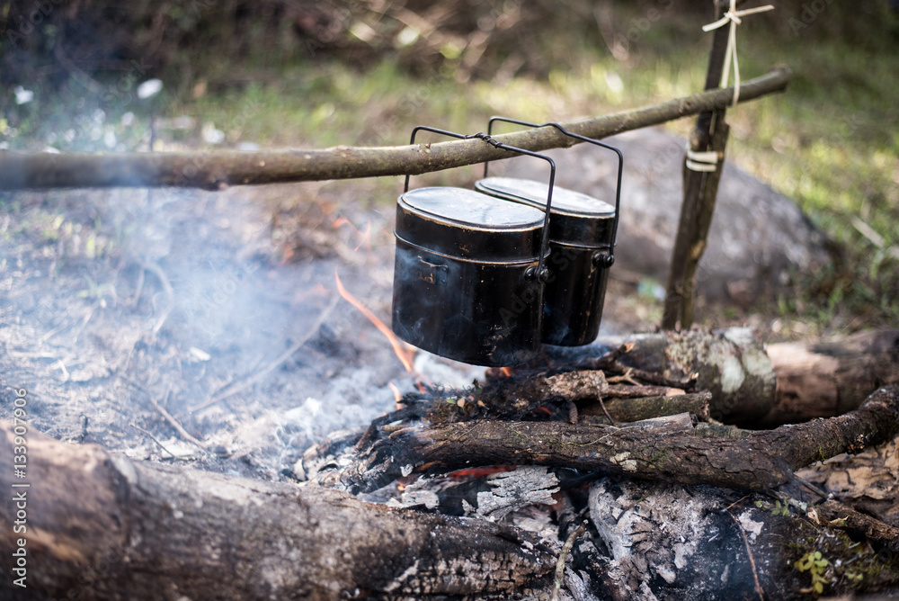 Cauldron boils on the fire in the forest Cauldron boils on the fire in the forest