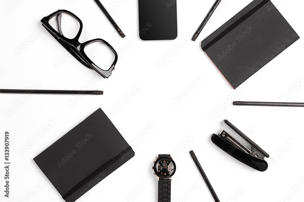 Blank notepad with clips, pens and glasses flat lay. Blank notepad with clips, pens and glasses flat lay.