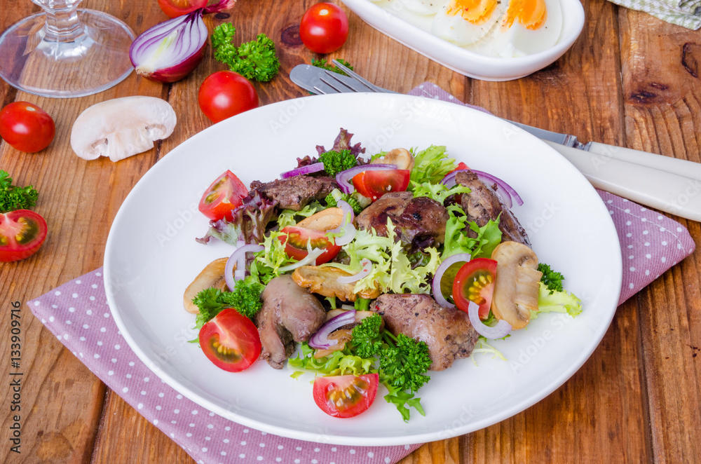 Salad with chicken liver, fried mushrooms and tomatoes Salad with chicken liver, fried mushrooms and tomatoes