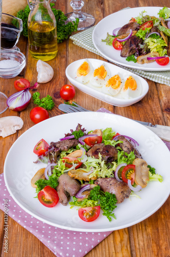 Salad with chicken liver, fried mushrooms and tomatoes