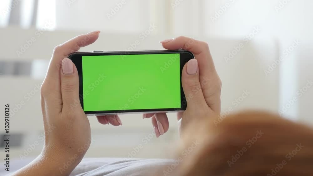 Greenscreen display smart phone in woman hands 4K 2160p 30fps UltraHD footage - Female relaxing in bed while holds green screen gadget 3840X2160 UHD video Greenscreen display smart phone in woman hands 4K 2160p 30fps UltraHD footage - Female relaxing in bed while holds green screen gadget 3840X2160 UHD video