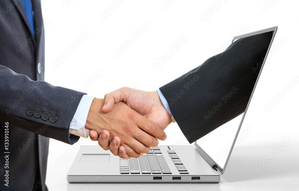 Fotografie Men shaking hands through a laptop screen. 3d illustration