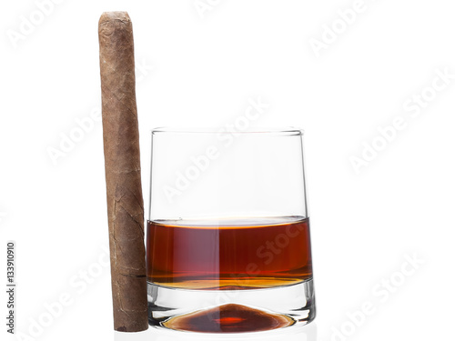 Cigar on a glass of whisky.