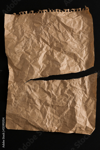 old paper sheet isolated on black background