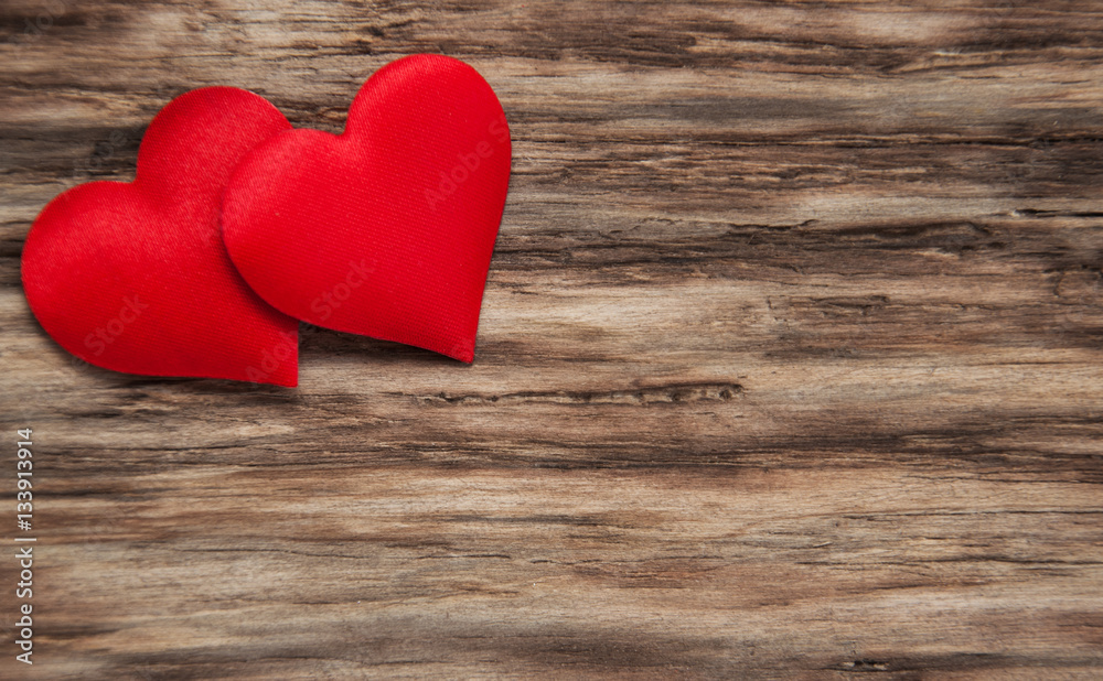 Red hearts on a wooden background Red hearts on a wooden background